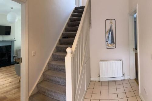 a stairway in a home with a stair case at House Bunratty Castle gardens in Bunratty
