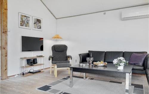 Μια τηλεόραση ή/και κέντρο ψυχαγωγίας στο Holiday Home Huginsvej