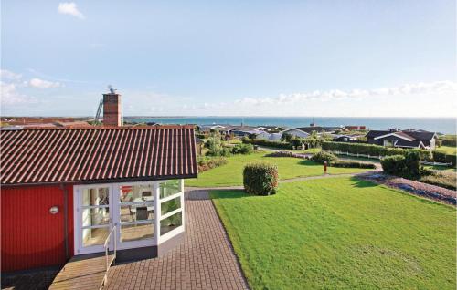 a red house with a view of the ocean at Holiday Home Huginsvej in Slagelse