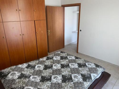 Ένα ή περισσότερα κρεβάτια σε δωμάτιο στο Apartment on the beach