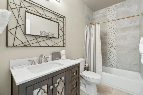 a bathroom with a sink and a toilet and a shower at 30A Pet Friendly Beach House - Beach Bayou by Panhandle Getaways in Santa Rosa Beach
