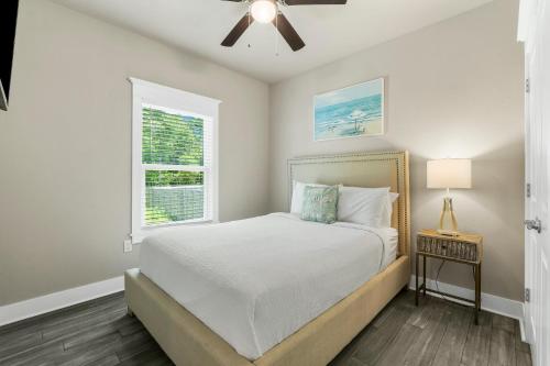 a bedroom with a bed and a window at 30A Pet Friendly Beach House - Beach Bayou by Panhandle Getaways in Santa Rosa Beach