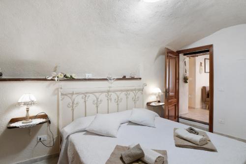 Postel nebo postele na pokoji v ubytování Agriturismo U' Spigu Nonna Annetta