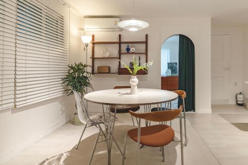 a dining room with a table and chairs at Emotional, 3type inteior style in Seoul