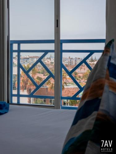 Ein Bett oder Betten in einem Zimmer der Unterkunft L'escale Appart-hôtel By 7AV HOTELS