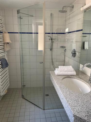 Ein Badezimmer in der Unterkunft Hotel Fletzinger