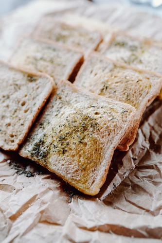 a group ofasted bread with herbs on it at Regielskie Chaty in Regiel