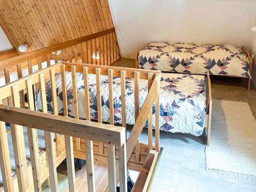 a bedroom with a bunk bed and a crib at Holiday Apartment Hirvas 1 in Saariselka