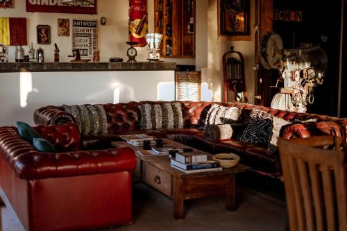 a living room with a leather couch and a coffee table at Ali Baba Infinity in Essaouira