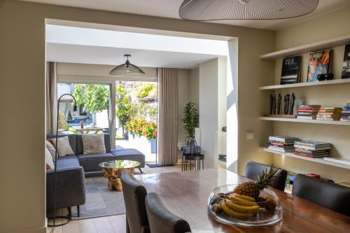 a living room with a table with bananas on it at 3 Kings in Bruges