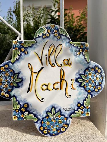 a blue and white plate with a hello kitty sign at B&B Villa Machi in Paola