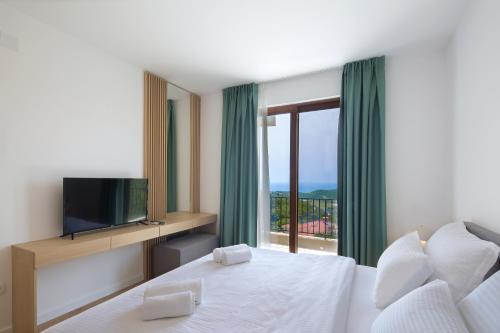 Ένα ή περισσότερα κρεβάτια σε δωμάτιο στο Villa Fotinia