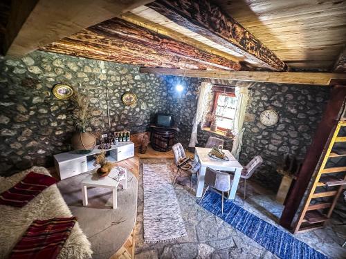 an overhead view of a living room with a table and chairs at Kužina in Plav