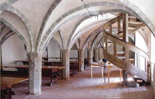a room with arches and tables in a building at Awesome Home In Tomelilla With Kitchen in Tomelilla