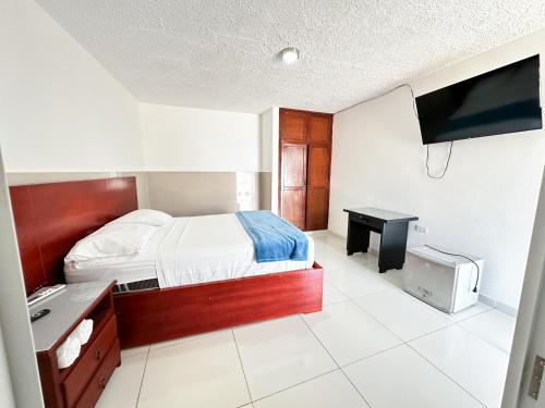 Postel nebo postele na pokoji v ubytování Hotel Winsor