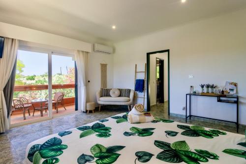 a bedroom with a bed and a living room at Quinta da Falfeira in Lagos