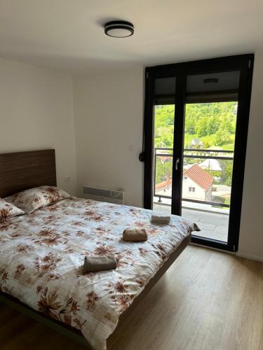Llit o llits en una habitació de AniMer Apartment