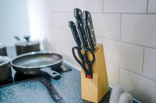 a knife block with scissors sitting on a counter at Middleton Chambers by Guestz in Hull