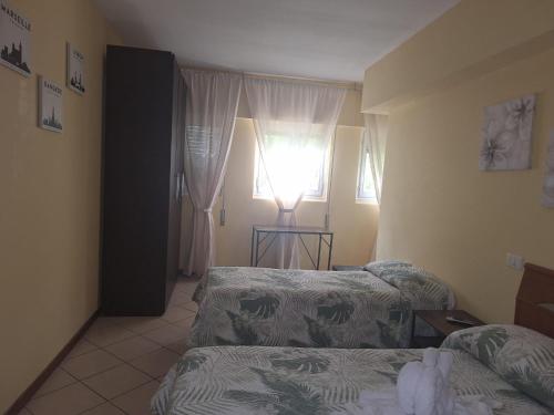 Katil atau katil-katil dalam bilik di Argentiere Room Apartments