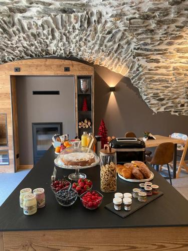 a table with a buffet of food on it at Grande Cote Room and Breakfast in Cesana Torinese