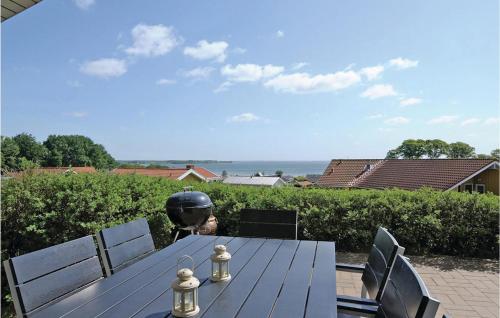a table with a helmet sitting on top of it at Holiday Home Hvedemarken Sjølund I in Sjølund