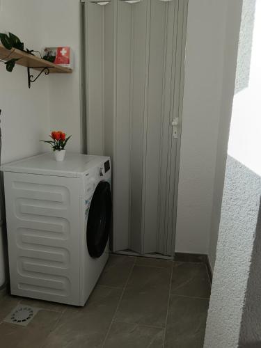 a white washer and dryer in a room at Atonika Apartments Bitola in Bitola