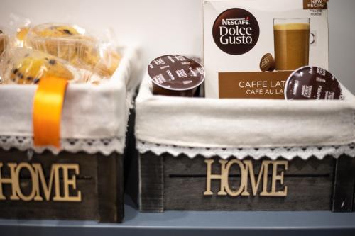two baskets of food with the words have and a box of have at Filo Apartment in Capua