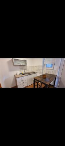 a kitchen with a table and a counter top at Grika apartment in Split
