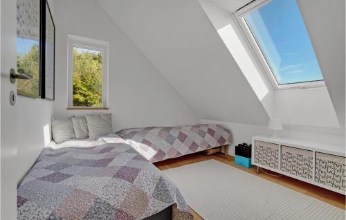 a bedroom with a bed and a window at Cozy Home In Fredericia With Wifi in Fredericia