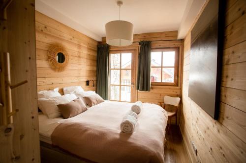 En eller flere senge i et værelse på La Petite Bulette