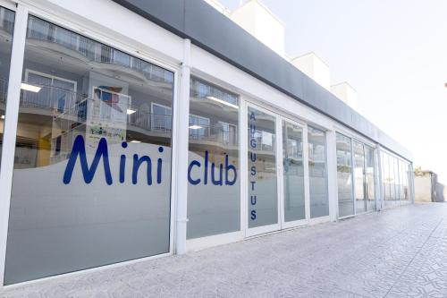 an office building with the micro club logo on the doors at Hotel Cesar Augustus in Cambrils