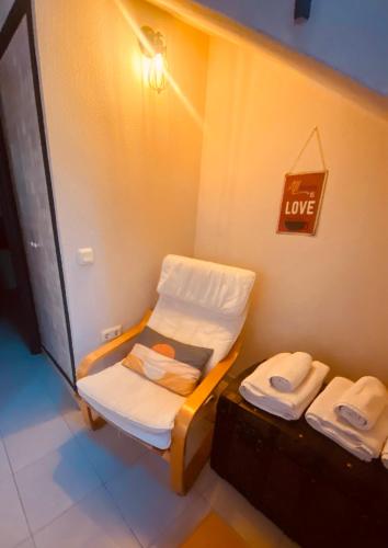 a room with a bed and a sign that says love at CASA LAS HERRERA in Casavieja