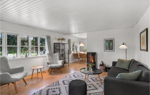 a living room with a couch and chairs at 3 Bedroom Lovely Home In Nykøbing Sj in Nykøbing Sjælland