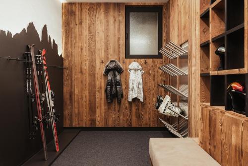 a walk in closet with wood paneling at Luxury Chalet Milé in Ortisei