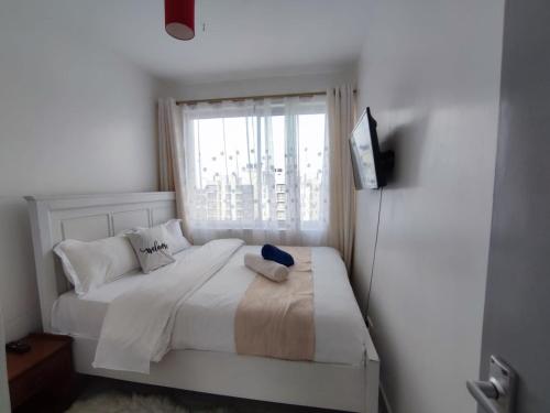 Llit o llits en una habitació de Racecourse Garden