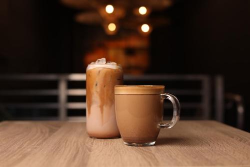 two cups of coffee sitting on a table at Smart Brickell Hotel in Miami