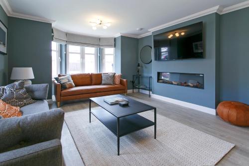 a living room with a couch and a coffee table at Troon No 1 Apartments in Troon