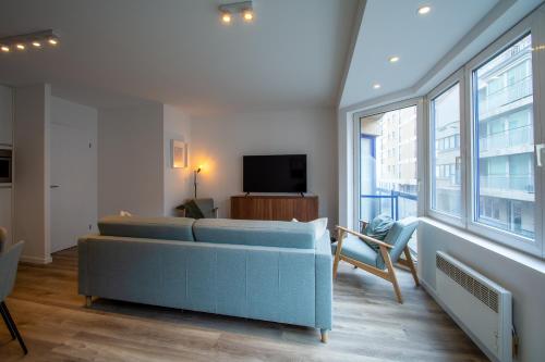 Μια τηλεόραση ή/και κέντρο ψυχαγωγίας στο Residentie Miguel - sea view and underground parking