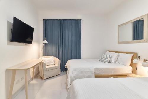 Katil atau katil-katil dalam bilik di Aquarella Beachfront 2BR Sunset Juan Dolio