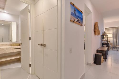 Katil atau katil-katil dalam bilik di Aquarella Beachfront 2BR Sunset Juan Dolio