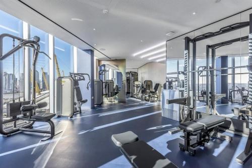 a gym with cardio equipment in a building at Greenwich-02 in London
