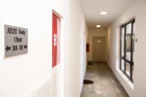 a hallway of a hospital with a sign on the wall at Apartments NIKOS FAMILY in Ulcinj