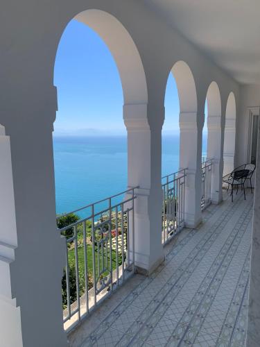 a balcony with a view of the ocean at Blue Sunset in Ravello