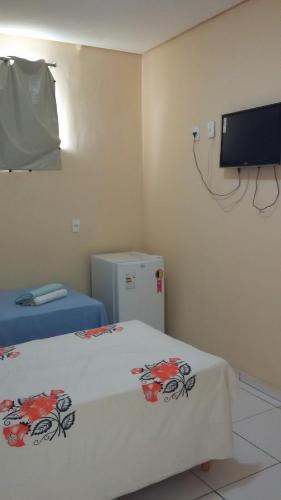 TV a/nebo společenská místnost v ubytování Condomínio Center luz