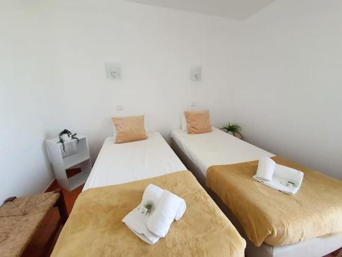 Ένα ή περισσότερα κρεβάτια σε δωμάτιο στο Apartamento do Moinho acesso à Piscina