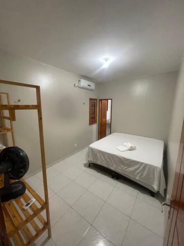 a bedroom with a bed in a room at Wing haouse in Cruz