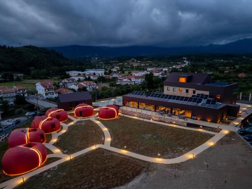 an overhead view of a building with red spheres at Cherry Sculpture Hotel in Paul