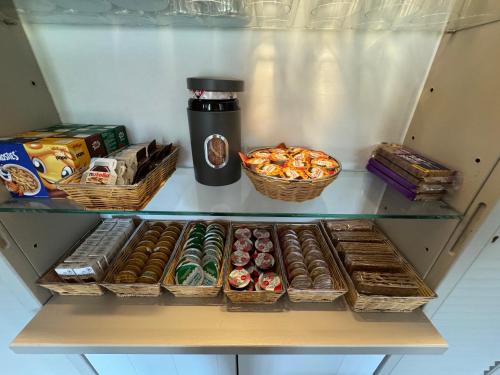 a refrigerator filled with lots of different types of donuts at Ouwe Schuure in Sluis