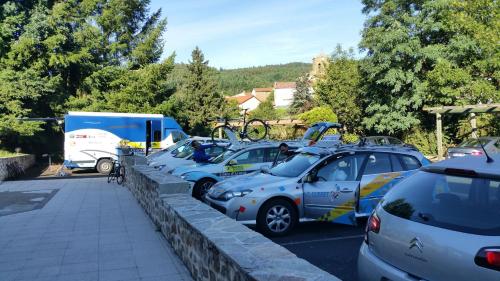 a row of cars parked in a parking lot at Hôtel Les Rives D'Allier in Mazeyrat-d'Allier