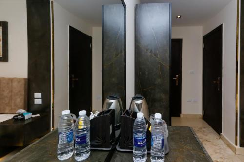a group of water bottles sitting on a table at Crowne Pyramids View inn in Cairo